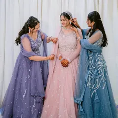 A bride getting ready with her bridesmaids. This photo captures the friendship and support that surrounds a bride on her engagement day, a beautiful moment of preparation and excitement.