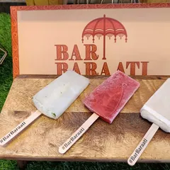 I go beyond drinks with unique treats like these alcoholic popsicles. Displayed on a rustic wooden board with custom hashtag sticks, they offer a fun and surprising way for guests to cool down and enjoy the party.