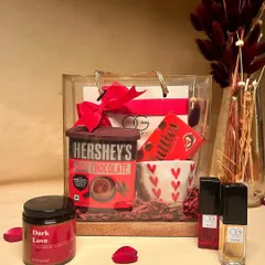 A different view of the 'Cozy Delights' hamper, this time presented in a stylish transparent bag. It’s a modern and chic way to gift comfort and indulgence.