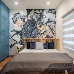 For a young anime fan, we designed this bedroom featuring a large, custom wall mural of their favorite character. The artwork becomes the focal point, creating a dynamic and personalized space.