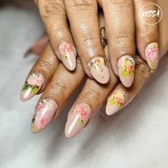 A perfect example of elegance. This hand-painted floral design on a neutral base is a client favorite. It’s subtle, sophisticated, and showcases the delicate brushwork that goes into creating timeless nail art.