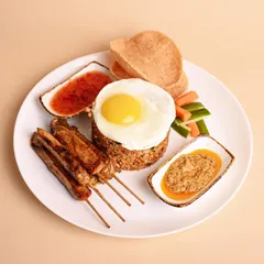 This Malay classic is a meal in itself. It features fragrant seasoned rice, tender chicken skewers, prawn crackers, and two of my secret sauces that I know you’ll love.