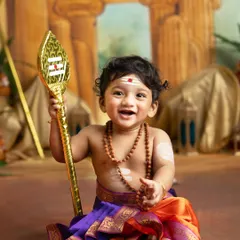 The happiest little Lord Murugan! His joyful smile and traditional attire, complete with the Vel spear, make for a divine and heartwarming portrait.