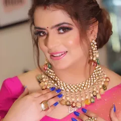 Here is a close up of a glamorous party makeup look I created. I focused on creating dramatic, smoky eyes and pairing them with a soft pink lip, all on a flawless HD base. This look is perfect for weddings and festive occasions.