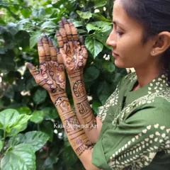 A beautiful bride showing off her intricate henna design. I love capturing these moments where the bride is admiring the art that will be a part of her wedding memories.