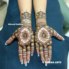This design features a central lotus medallion on the palm, surrounded by delicate floral patterns. It's a perfect blend of traditional motifs and modern aesthetics.
