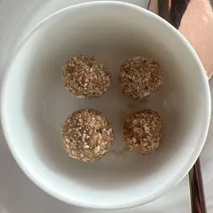Tilgul ladoos, made from sesame and jaggery. This traditional sweet is warming and nourishing, perfect for balancing the 'kapha' dosha that accumulates during winter.