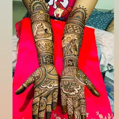 A full bridal set telling two stories. One arm depicts a wedding ceremony with the couple, while the other features traditional symbols like the kalash, creating a complete narrative.