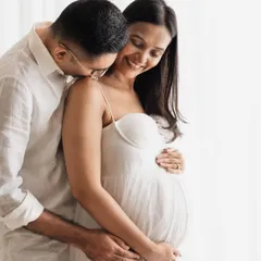 I live for capturing these quiet, tender moments between a couple. This close-up shot was taken in my studio with soft, natural-style lighting. Their simple white outfits and the gentle connection they share tell a beautiful story of love and anticipation.