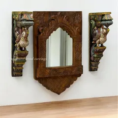A beautiful wooden mirror frame, paired with two colorful parrot brackets. This set is a perfect example of how our carvings can be both functional and highly decorative, adding a unique traditional touch to your home.