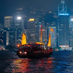 A traditional junk boat sailing across Victoria Harbour, with the modern skyline as a backdrop. This contrast between old and new is what makes Hong Kong so visually interesting.