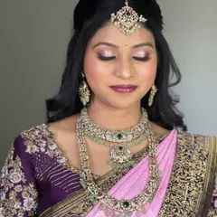 A detailed shot of the eye makeup for Pavitra's reception look. The soft shimmer and defined liner make her eyes pop, perfect for an evening event.