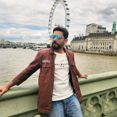 Posing with the London Eye in the background. This image combines a casual outfit with an iconic landmark, showcasing my potential for international travel and tourism promotions.
