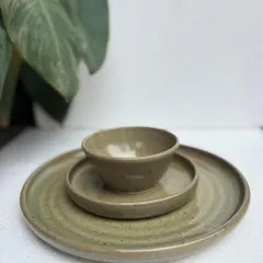 Our complete Green Celadon dinner set. This three-piece place setting, including a dinner plate, side plate, and bowl, is perfect for elevating your everyday meals. We can create sets like this in any of our custom glazes.