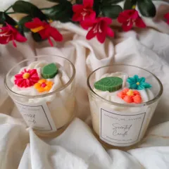 Vibrant floral embellishments make these jar candles a beautiful decor piece. They are made with 100% natural soy wax for a clean, long-lasting aroma.