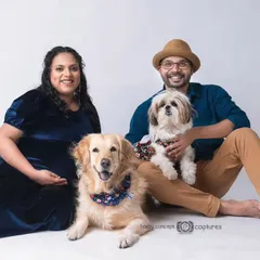 An identical shot from the same pet-friendly maternity session. Capturing the whole family, including the furry members, is a wonderful way to document this special time.