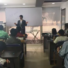 A full view of one of my magic workshops in Bangalore. We use a classroom setup with a whiteboard so I can clearly explain the secrets behind each trick before you practice it yourself.