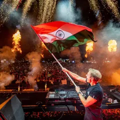 A truly iconic moment of pride and unity. Trance legend Armin van Buuren holding the Indian flag high above the decks, with flames and fireworks erupting behind him. These are the powerful, emotional connections we forge between artists and fans.