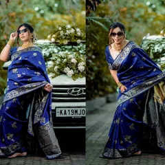 A stylish bride poses in a stunning blue saree for her Roce ceremony, showing how we capture the modern glamour of traditional events.