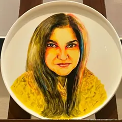 The companion piece to the previous portrait, this is a ceramic plate painting of author and journalist Seema Goswami. Capturing a likeness with ceramic paints, which behave differently from acrylics, was a great learning experience.