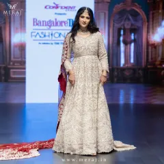 This is couture in motion. A showstopper tail gown from my runway collection, designed for the modern queen who commands attention. The intricate embellishments and dramatic silhouette redefine luxury and elegance.