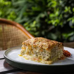 My Vegetable Lasagna is pure comfort. Layers of fresh pasta, roasted vegetables, and creamy béchamel sauce are baked until golden and bubbly. It's a hearty and satisfying dish, perfect for a cozy meal.