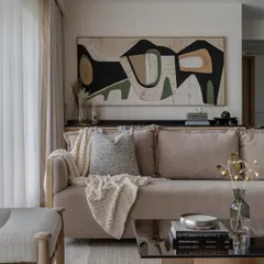 A full view of the abstract art installation in a Mumbai residence, showing how it integrates with the overall interior design. The piece adds character without overwhelming the serene atmosphere.