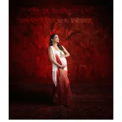 An ethnic maternity shot that is both powerful and divine. The Gayatri Mantra in the background adds a sacred, spiritual layer to this beautiful portrait.