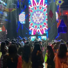 A view from the dance floor, where my VDJ graphics serve as the vibrant backdrop for the entire party. The visuals are synchronized with the music to enhance the energy.