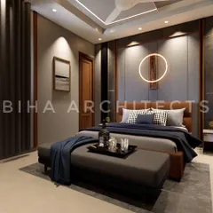 We designed this modern bedroom with a focus on mood and ambiance. A circular LED light fixture on the textured headboard wall creates a unique artistic statement. The combination of dark wood, grey fabric panels, and deep blue textiles results in a sophisticated and masculine aesthetic.