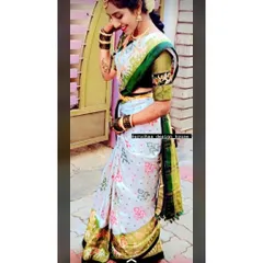 A candid moment showing how the custom blouse complements the bride's entire look. The sleeve embroidery adds a personal touch to her traditional wedding day attire.