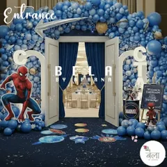 The entrance to the Marvel party, designed to make guests feel like they're entering another dimension. A dense arch of blue balloons, planetary floor decals, and a Spider-Man cutout create an exciting welcome.