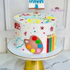 Where cake meets canvas. This hand-painted cake was designed for a young artist's 3rd birthday, featuring a fondant palette, colored pencils, and colorful, child-like doodles all over.