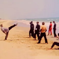 This photo was taken 20 years ago, showing me conducting a class on the beach. My passion for teaching has remained unchanged, whether on sand or in a dojo.