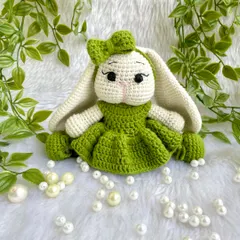 Look at this adorable bunny with her long, floppy ears and sweet green dress! I love when customers have unique ideas, and this long-eared bunny was a joy to bring to life. She is so soft and posable.
