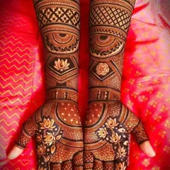 A highly personalized and symmetrical design. This features the couple's initials 'P' and 'H' on the arms, along with lotus and rose motifs, all done with 3D shading.