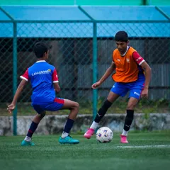 A one-on-one drill in progress, where players learn to use their skills under pressure. These competitive scenarios are vital for building game intelligence and confidence.