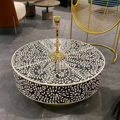 We can't take our eyes off this beautiful bone inlay coffee table. The intricate, handcrafted floral pattern in black and white creates a stunning graphic statement, perfect for adding a touch of artisanal luxury.