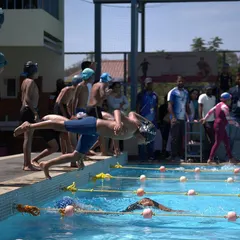 From the "take your mark" position, our swimmers learn to anticipate the start, channeling their energy into a forward launch.