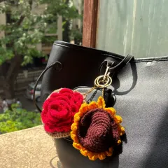Both the rose earphone case and the sunflower coin purse are shown together here. You can see how they work as a set or as individual statement pieces.