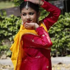My student Ishani in her performance attire. In my classes, I emphasize not just the movements but also the importance of presentation and carrying oneself with the grace that Kathak demands.