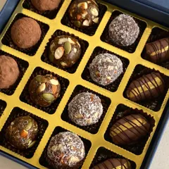 A close-up of the all-natural energy bites from my Healthy Bites Hamper, featuring dates, figs, nuts, and seeds.