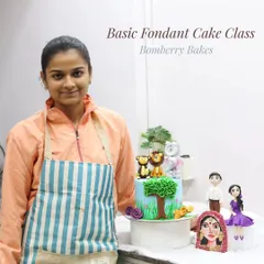 A proud student moment from my Basic Fondant Cake Class. Here, she showcases her final projects, including a jungle-themed cake, hand-painted Indian bride portrait, and custom couple figurines.