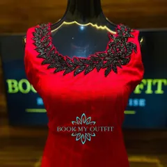 A classic red gown is always a showstopper. For this piece, I added a contrasting black beaded appliqué around the neckline, creating a bold, leaf-like pattern that makes the dress unique.