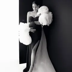A quiet, contemplative moment. This black and white portrait of the mamma in a glamorous gown is full of grace and emotion.