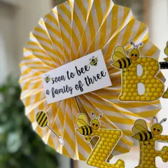 "Soon to bee a family of three." I love adding these little personalized notes and themed decorations to make the gift extra special and memorable.