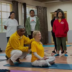 Personal guidance is key to a safe and deep practice. Here, I am helping a student find a steady and comfortable posture for pranayama, ensuring the spine is erect for the optimal flow of prana, or life-force energy.