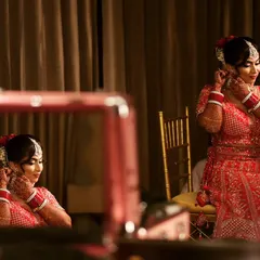 A candid shot of my bride getting her final touches in front of the mirror. It's that last look before she walks out to her new beginning.