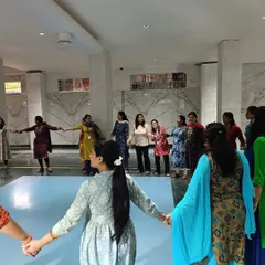 Connection is key. This circle of teachers holding hands is a physical representation of the community and trust we build in my workshops, which is essential for creating a positive learning environment.