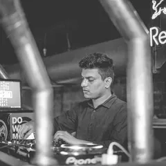 A shot of me deep in concentration at the console. Whether it's a high-energy club night or a sophisticated corporate event, I give my full attention to reading the room and playing the perfect track at the perfect moment.